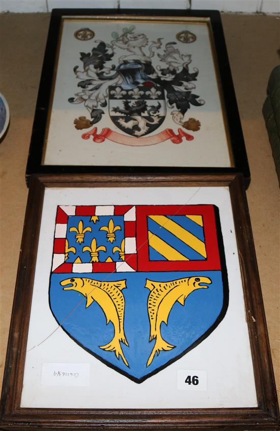 2 framed family crests